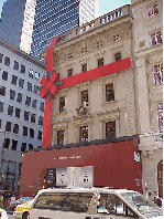 One of the prettiest stores on Fifth Avenue is getting a face lift during the holiday season.  Cartier on Fifth Avenue is wrapped up in their big red bow with a Band-Aid too.