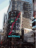 Top right picture you see the Nasdaq Sign in Times Square.  You can stand in the center of Times Square and watch TV or get stock quotes all day and night.