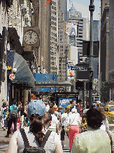 Bottom right picture you see the sidewalk in front of Macy's. Sidewalks in New York City are very precious pieces of real estate. Many stores leave the doors open in the summer so that the cool air conditioning might lure customers inside.
