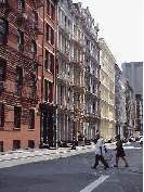 Top right picture you see the World Trade Towers as seen from West Broadway in Soho. Center right picture you see an example of the great cast iron buildings of Soho.  Many of the buildings are home to artists.