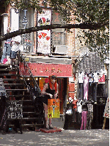 Bottom right picture you see shops on St. Marks' Place in the East Village. You'll see cool clothes and the cool people here. More East Village fashions in Zoom Zone.