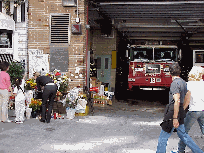 Firehouse memorial in the West 20's showing flowers and care for fallen firefighters.