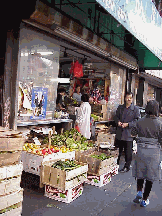 Top right photo you see a Chinese market in Chinatown.  All through Chinatown you'll find these great markets selling fresh fruits, vegetables and spices.