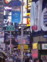 Center right picture you see a picture taken on Broadway and West 46th Street. As you can see there are signs, people, and lights everywhere!