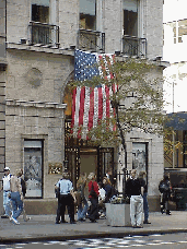 If you're going to shop until you drop, then fall weather will help you last a little longer.  Top right you see New Yorkers shopping on Fifth Avenue. That's a picture of Harry Winston's on Fifth Avenue with the large American flag over the door.