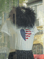 Center right you see a window on Madison Avenue.  That's one of the new designer T-shirts.  Of course, you must accessorize Darling!