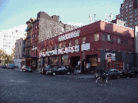 Bottom right picture you see Little West 12th Street. The spacious old warehouses have been painted, decorated and reopened to wealthy clientele and tourists. You even see buses and walking tours. The butchers must wonder what all the fuss is about.