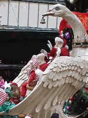 Center right picture you see the man of the day, Santa Claus. This picture was taken at the Macy's Thanksgiving Day parade when he first came to town. We're all glad he came back around last night!