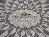 Center right picture you see the memorial to John Lennon at Strawberry Fields in Central Park. Recently when George Harrison died, people gathered here to remember him.