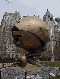 This sculpture by Fritz Koenig stood in the plaza of the World Trade Center for years as a symbol of world peace.  After withstanding the attacks of 9/11, The Sphere has moved to Battery Park as a memorial to the event.