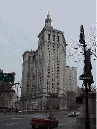 Center right picture you see the Municipal Building.  If you continue to the right you would cross the Brooklyn Bridge.