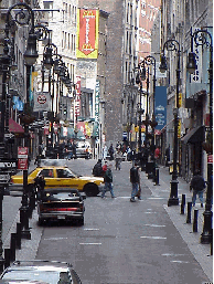 Bottom right picture you see Nassau Street on a quiet Sunday morning.  Traffic is closed off on Nassau Street during the week and the shoppers take over. Nassau Street is lined with stores and restaurants. It's also blocks away from South Street Seaport.