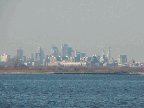 Center right photo you see the island of Manhattan as seen from the Rockaways.  This is the skyline of lower Manhattan.