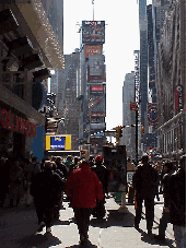 Top right picture you see a street level view of Broadway in Times Square. Times Square is so entertaining. You'll see plenty of street entertainment and sometimes you'll pass by stars being interviewed on the sidewalk. The signs are very eye catching.