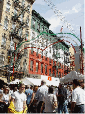 See people enjoying the Feast of Gennaro in Little Italy