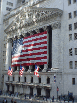 New York Stock Exchange (NYSE), and the huge American flag