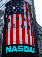 Nasdaq sign showing off the American flag