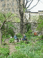 A couple and their friend taking a break in an East Village garden