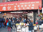 Second picture you see a fish market and merchants selling produce on the sidewalk
