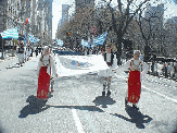 Athens 2004 Flag in Greek Independence Day Parade, NYC Pictures featuring American Greeks marching on 5th Avenue at the Greek Independence Day Parade 2004.
