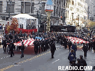 American Flag in 2 Pieces from WTC Disaster Photo 75th Annual Macy's Thanksgiving Day Parade Pictures on 34th Street New York, NY. Images of NYC Parade Floats and Balloons.